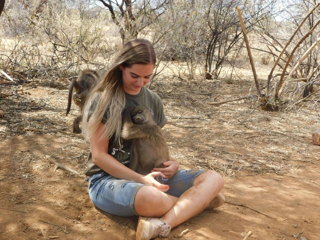 Sophie volunteering with rescued rhinos, baboons, cheetahs and the wider team at the N/a'an ku se Foundation reserve in Namibia, November 2018