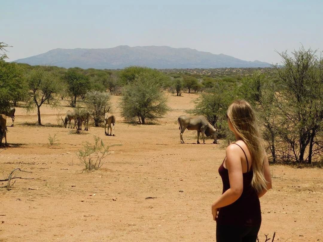 Sophie volunteering with rescued rhinos, baboons, cheetahs and the wider team at the N/a'an ku se Foundation reserve in Namibia, November 2018